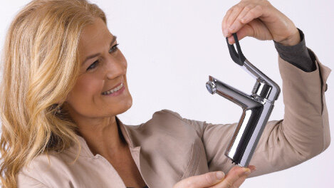 Woman holding the one handle tap